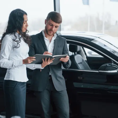 Buying a used car checklist step showing buyers checking car details before purchase